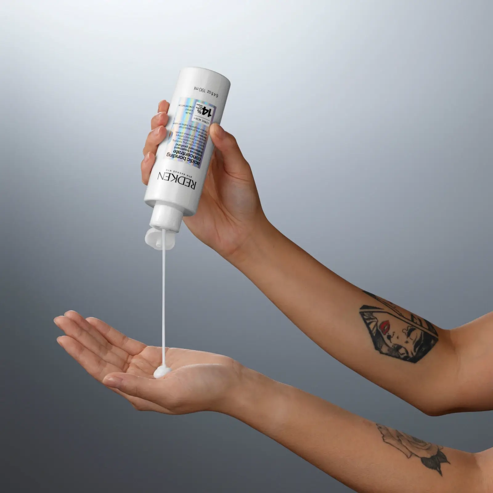 Redken Acidic Bonding Concentrate Intensive Pre-Treatment being poured into hand